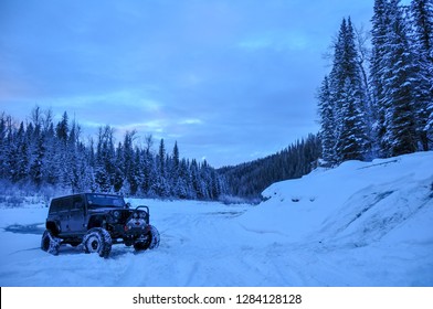 Alberta, Canada - December 12, 2018: Black Jeep Wrangler JK Unlimited Rubicon On Winter Mountain Trail