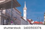 Albertina Square aerial timelapse with historic buildings, tower, tourist buses, people and traffic in downtown Vienna, Austria