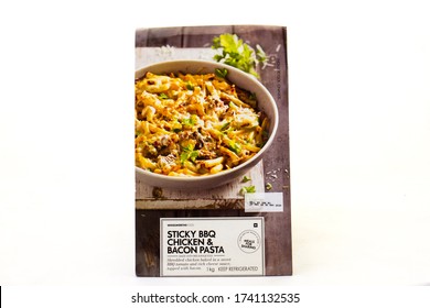 Alberton, South Africa - May 25, 2020: Sticky Bbq Chicken And Bacon Pasta From Woolworths Food Isolated On A Clear Background Image With Copy Space In Horizontal Format