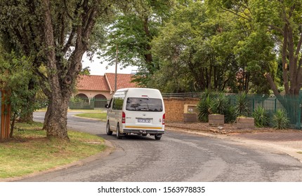 Alberton, South Africa - November 18, 2019: A Privately Operated Minibus Taxi Travels On A Street Through A Residential Suburb Image In Horizontal Format