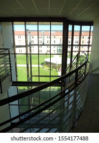 Albi, France - July 2015 - Staircase And Mezzanine Inside The National University Institute Jean-François Champollion, And Bay Windows Exterior Facing With View Of The Campus And Its Green Areas