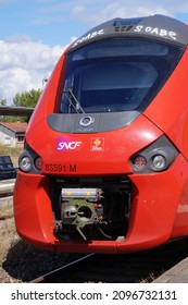 Albi, France - June 2021 - Front Of The Train Engine Of A Modern, Red Alstom Régiolis TER, A Regional Express Train Produced By French Manufacturer Alstom, And Run By SNCF For The Occitanie Region