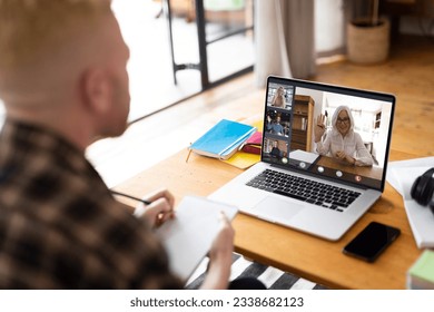 Albino african american man making laptop video call with diverse colleagues on screen. Business communication, flexible working, inclusivity and digital interface concept. - Powered by Shutterstock