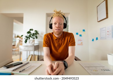 Albino african american man working from home making video call. remote working using technology at home. - Powered by Shutterstock