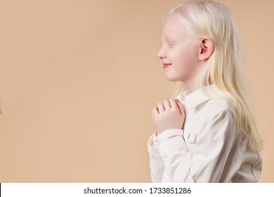 Albino. Cute caucasian little girl with albinism syndrome, natural beauty and people diversity concept. side view
