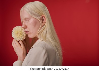 Albino Girl Posing With Flower
