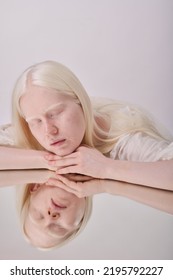 Albino Girl Posing With Mirror