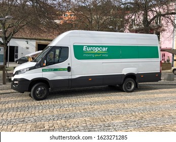 Albufeira, Portugal - December 26, 2019: White Europcar Mercedes Sprinter parked by the side of the road. Nobody in the vehicle. 
