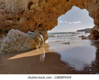 Albufeira seashore natural rock arch, Algarve Portugal.