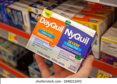 Albuquerque, New Mexico / USA - November 2 2020: Box Of Vicks DayQuil And NyQuil Acetaminophen Pills Held By A Man In The Walmart Pharmacy And Over-the-counter Medication Aisle