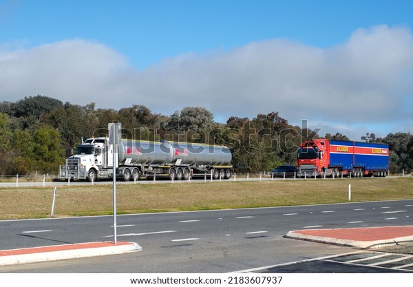 Albury NSW\
Australia-July 9 2022: heavy trucks on an Australian country\
highway. The trucking industry is considered a significant player\
that help boost the Australian\
economy.