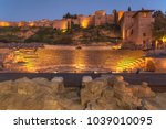 Alcazaba, the fortress palace (citadel) with ruins of roman theater in foreground, Malaga, Spain 