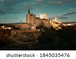 Alcazar of Segovia at night as the famous landmark in Spain.