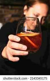 ALCHOLIC DRINK IN CLEAR GLASS BEAKER.