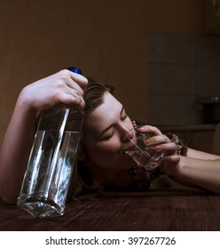 Alcohol abuse. Drunk woman holding bottle and drinking her alcoholic drink. Female alcoholism.