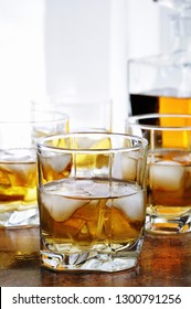 Alcohol Cocktail With Brandy, Whiskey Or Rum With Ginger Ale, Lime And Ice In Glasses  