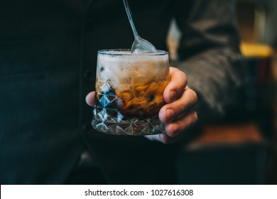 Alcohol Cocktail On The Bar. Bartender Making An Alcoholic Cocktail. Irish Cofee