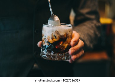 Alcohol Cocktail On The Bar. Bartender Making An Alcoholic Cocktail. Irish Cofee