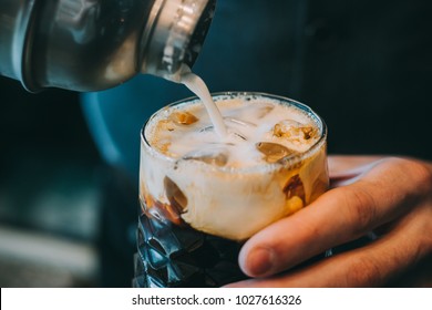 Alcohol Cocktail On The Bar. Bartender Making An Alcoholic Cocktail. Irish Cofee