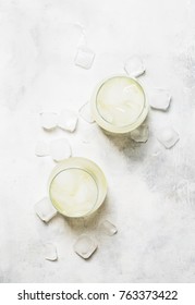 Alcohol Cocktail Prosecco On The Rocks With Sparkling Wine And Ice Cubes, Gray Background, Top View