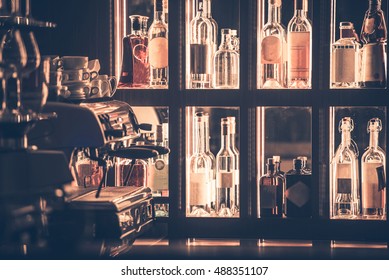Alcohol And Coffee Bar Closeup. Bar Shelf Full Of Alcohol Bottles And Professional Espresso Coffee Maker