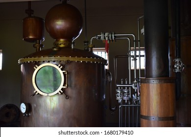 Alcohol distillation equipment, vintage copper tank with gauge. - Powered by Shutterstock