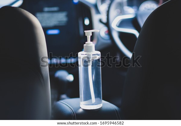 Alcohol gel 70% in car  for cleaning hands
everywhere  soft focus