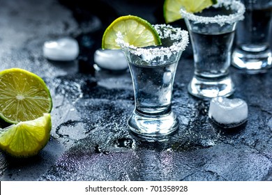 Alcohol Shots With Lime And Salt On Black Background