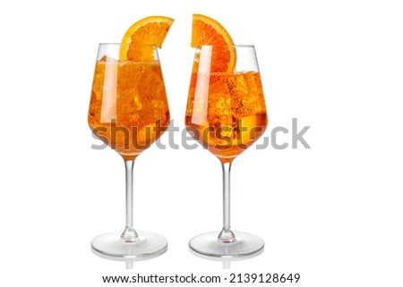 Alcoholic Aperol Spritz Cocktail in two glasses with orange slice, Isolated on White, copy space