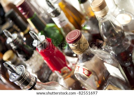 Alcoholic beverages in bottles at a bar.