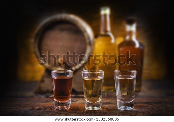 alcoholic beverages, cachaça, drips, rum and brandy.\
Selection of strong and hard alcoholic drinks, glasses. Vodka,\
brandy, tequila, brandy and whiskey, grappa, liqueur, vermouth,\
tincture, rum.