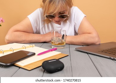 Alcoholic Business Woman Drinks At Work Sitting At A Desk. Alcohol. Laptop. Office. Problem Concept. Whiskey Glass. Depressed. Stress