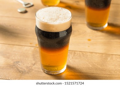 Alcoholic Cider and Beer Black Velvet in a Glass