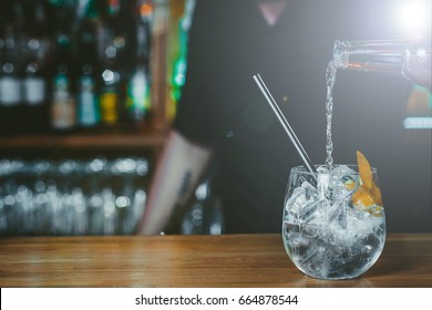 Alcoholic Cocktail In Bar, Bartender Making Gin Cocktail With Garnishes 