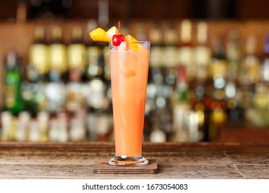 Alcoholic Cocktail With Grapefruit And Lemon Juice, Kuitaille Long, Garnished With Citrus Peel And Cherry
