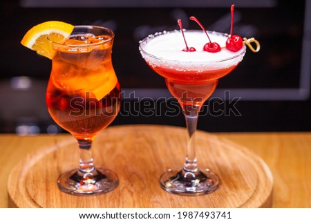 Alcoholic cocktail on wooden board