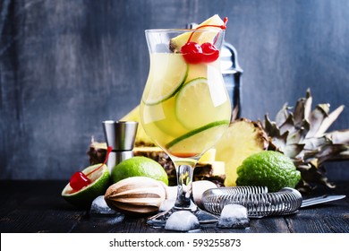 Alcoholic Cocktail Pisco Punch With Brandy, Syrup, Pineapple And Lime Juice, Ice, Garnished With Lime And Red Maraschino Cherry, Selective Focus