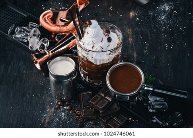 Alcoholic Cocktail White Russian. Coffee Liqueur On A Black Wooden Background.