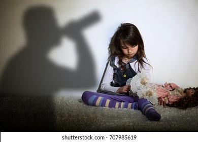 Alcoholic family - sad and lonely young girl - Shutterstock ID 707985619