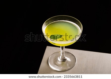 Alcoholic Gin Basil Smash Cocktail, gin, basil leaves, fresh lemon juice and syrup
