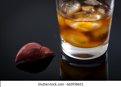 Alcoholic Liver Damage And Cirrhosis Concept With A Liver Next To A Glass Of Alcohol. Cirrhosis Is Most Commonly Caused By Alcoholism, Hepatitis B Or C Or Non-alcoholic Fatty Liver Disease