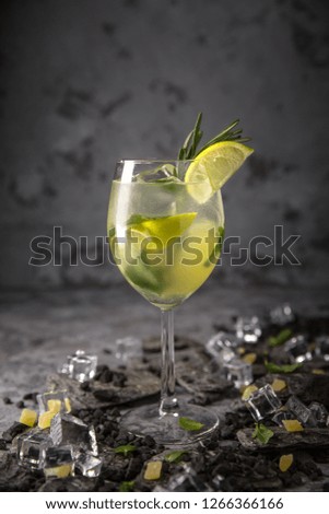 Alcoholic or non-alcoholic cocktail with lime citrus with the addition of liquor, vodka, champagne or martini. Cool drink.
