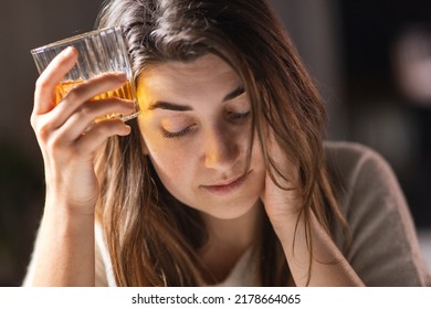 alcoholism, alcohol addiction and people concept - drunk woman or female alcoholic drinking whiskey at home - Shutterstock ID 2178664065