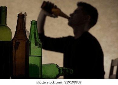 Alcoholism among young people - teenager drinking beer