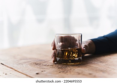 Alcoholism concept. Young man drinking alcohol too much. drunk asian man hold whisky glass addicted alcohol need therapy. - Powered by Shutterstock