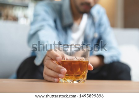 Alcoholism concept. Young man drinking alcohol too much.
