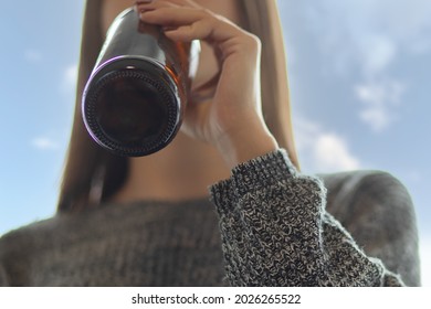 alcoholism of minors,teenager girl drinking beer in a bottle,young woman with problems with liquors, Quit booze concept - Shutterstock ID 2026265522