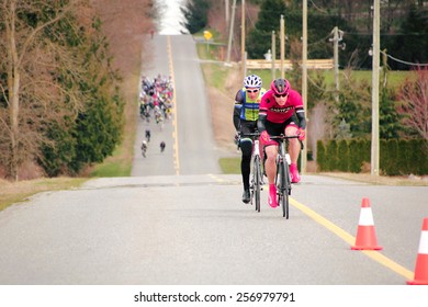 ALDERGROVE, BC/CANADA - MARCH 1, 2015: Two Cyclists Lead The Pack During The Escape Velocity Spring Series Cycling Race Near Aldergrove, British Columbia On March 1, 2015. 