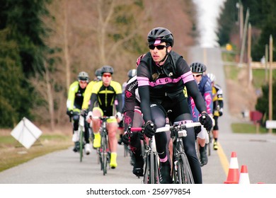 ALDERGROVE, BC/CANADA - MARCH 1, 2015: A Cyclist Leads The Pack During The Escape Velocity Spring Series Cycling Race Near Aldergrove, British Columbia On March 1, 2015. 