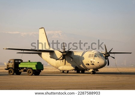The Alenia C-27J Spartan military transport aircraft and a fuel truck.